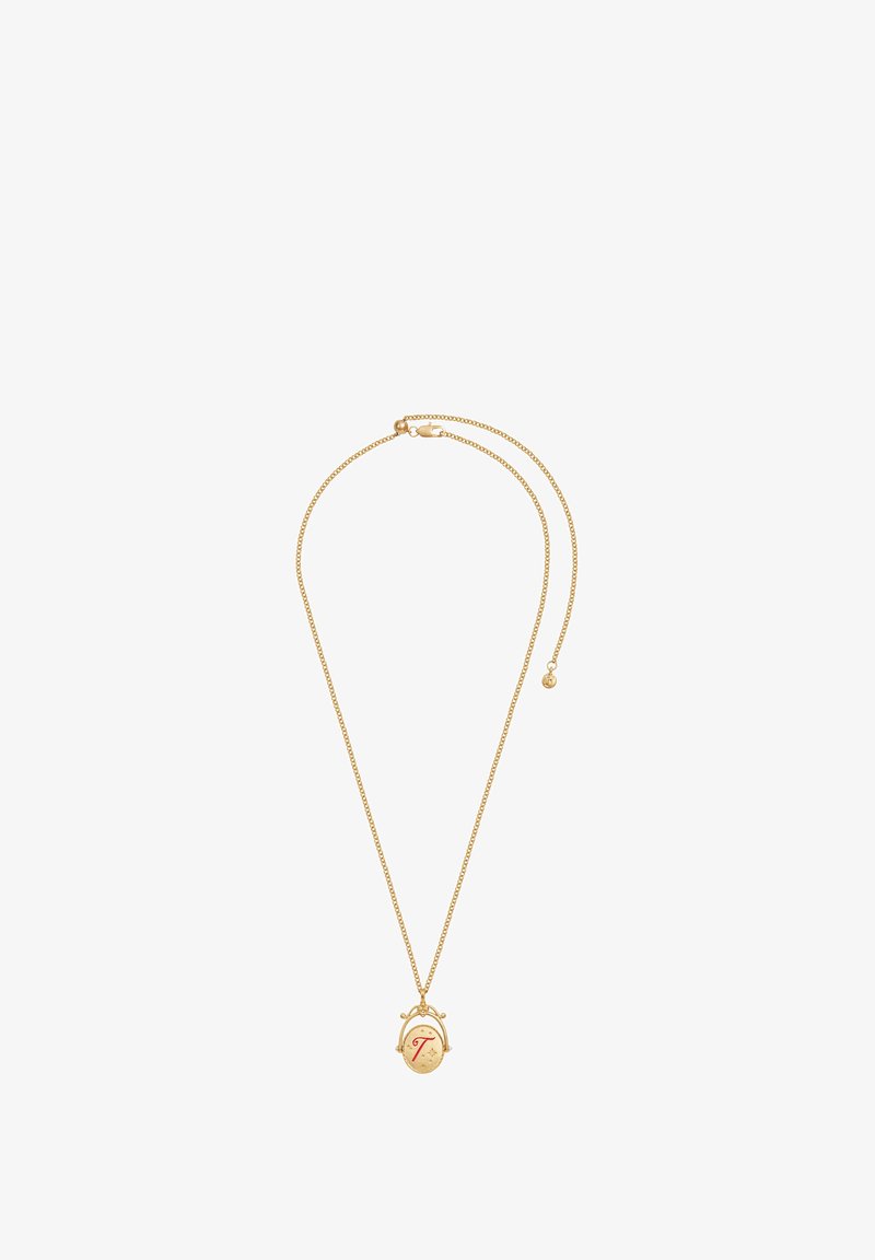 Kuldne kaelakee, millel on ümmargune ripats tekstuurse pinnaga ja stiliseeritud punane täht "T" keskel, kinnitatud lukuga.