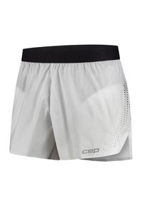 Weiße Laufshorts mit einem schwarzen elastischen Bund, die auf einer Seite ein gepunktetes Muster und am Saum ein silbernes Logo aufweisen.