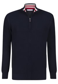 Marinblå zip-up sweatshirt med ribbat mönster, hög krage och randig inre krage i rött och vitt. Har sidofickor och åtsittande ärmslut.