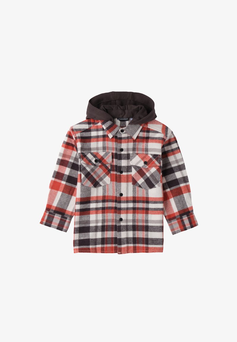 Camicia di lana a quadri in rosso, nero e bianco. Presenta un cappuccio marrone, due tasche sul petto con chiusura a bottoni e una chiusura frontale con bottoni.