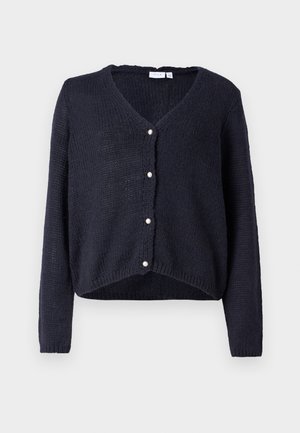 Navy knit cardigan with a v-neckline, front-button closure featuring five pearl buttons, cropped hem, and long sleeves. Textured fabric.