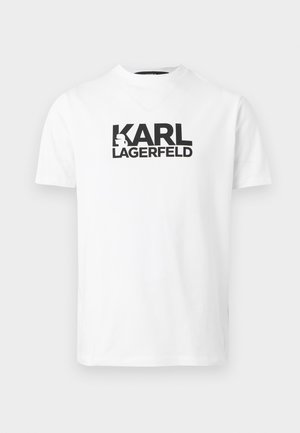 T-shirt blanc à manches courtes, col rond, avec le texte noir "KARL LAGERFELD" et le logo silhouette centrés sur la poitrine.