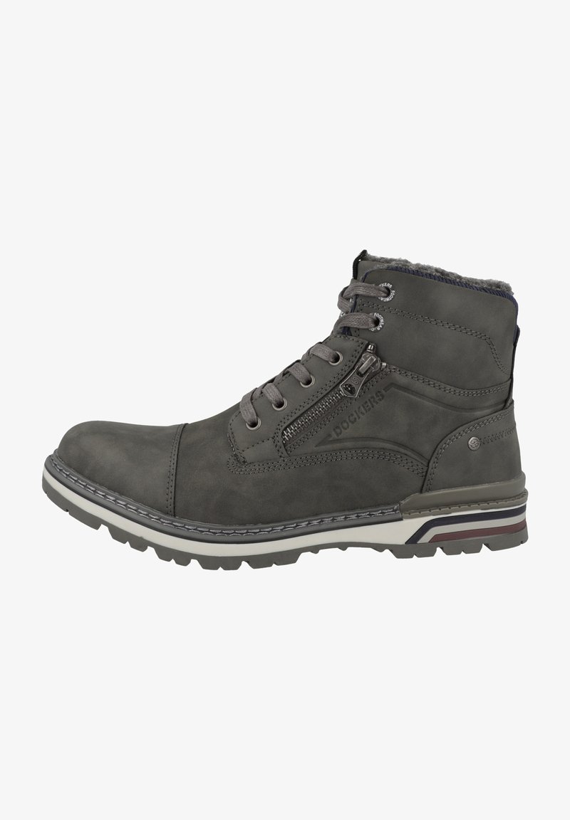 Grijze leren enkelboot met een gestructureerde afwerking. Beschikt over een zijrits, metalen oogjes en een contrasterende witte rubberen zool met strepen.