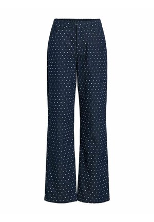 Pantalon large bleu marine à pois blancs, conçu avec une ceinture élastique et un tissu lisse pour le confort et la facilité de port.