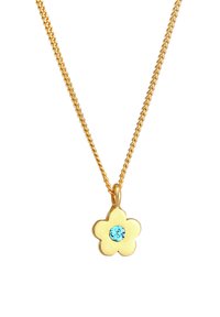 Guldsmykke med en blomstformet medaljon med en lys blå ædelsten i midten. Kæden har et snoet mønster.