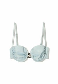 Light blue push-up bra with ruched fabric, thin adjustable straps, and a metallic clasp featuring a shell design. Smooth texture.