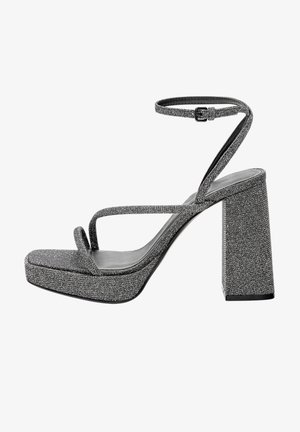 Sandales à plateforme grises pailletées avec un talon bloc, une fine bride à la cheville et un design avant en forme de V. Finition texturée avec une semelle lisse.