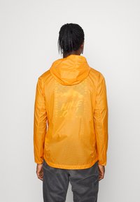 Patagonia HOUDINI - Corta-vento - cloudberry orange
