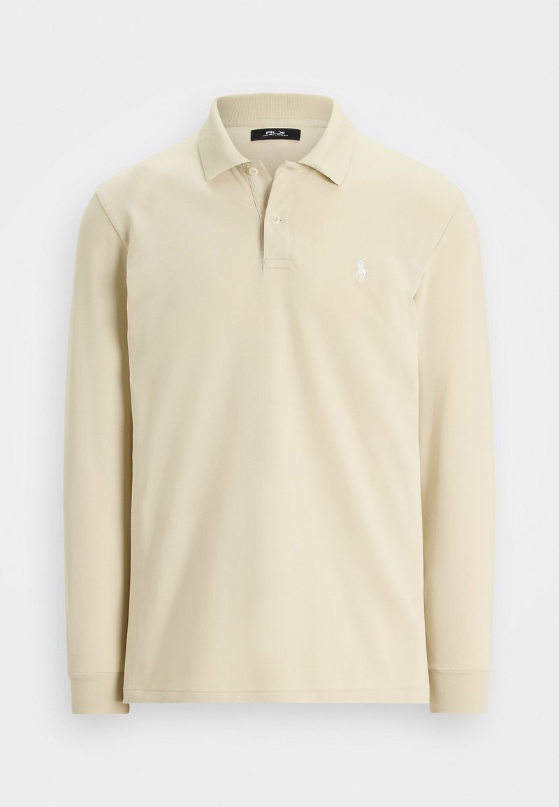 Polo beige à manches longues avec col, deux boutons, poignets côtelés et petit logo brodé blanc sur la poitrine gauche.