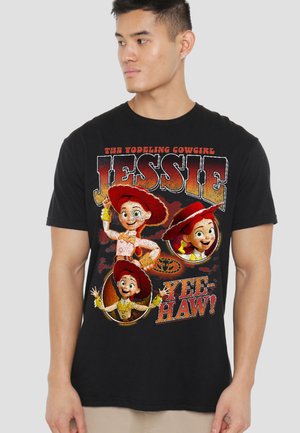 Man wearing a black T-shirt featuring Jessie, the yodeling cowgirl character from Toy Story, with "Yee-Haw!" text in red and orange.
