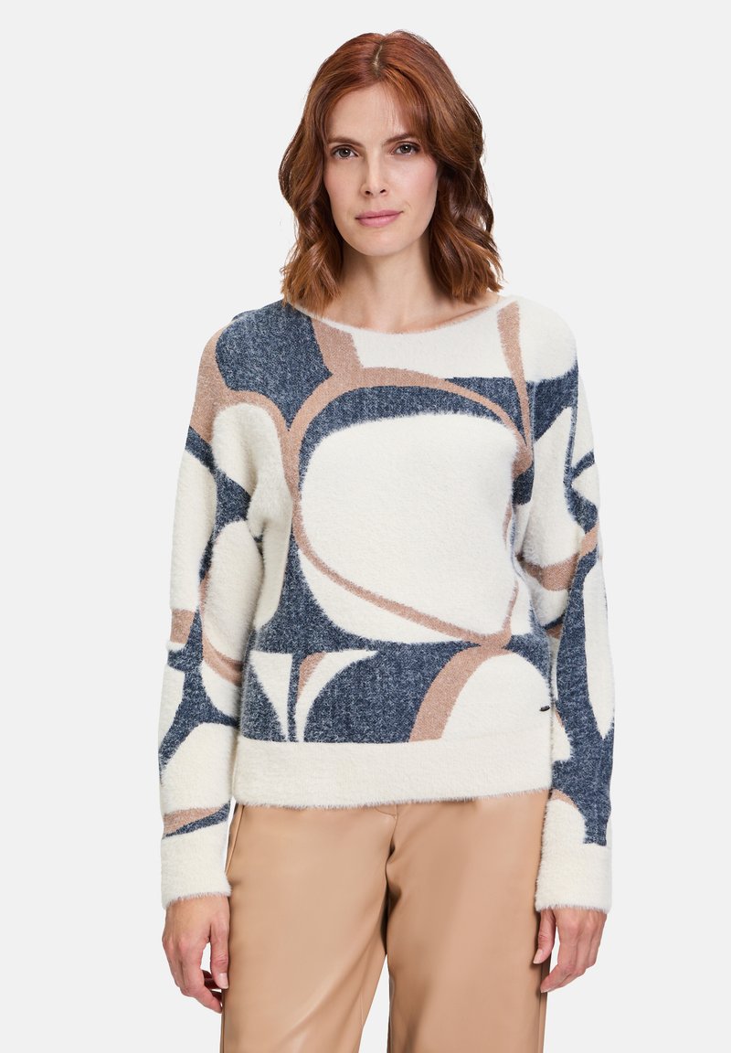 Fleece-Pullover in Creme, Blau und Brauntönen; mit lockerer Passform, rundem Ausschnitt und weichem, strukturiertem Stoff.