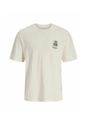 Cream-colored cotton t-shirt with a crew neck. Features a small graphic print on the left chest, text reads "RENAGADE 1990." Short sleeves.