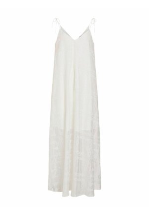 Robe longue blanche sans manches avec fines bretelles nouées aux épaules et détails subtils de broderie florale.