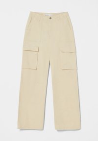 Beige cargo byxor med lös passform, som har två framfickor och två stora sidofickor. Tillverkade av slitstarkt tyg, designade för funktion.