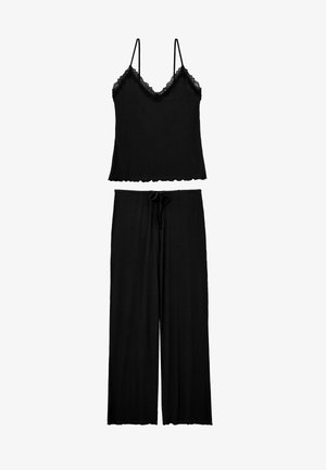 Set pigiama nero a coste con canotta rifinita in pizzo con spalline sottili e pantaloni a gamba larga con coulisse in vita.