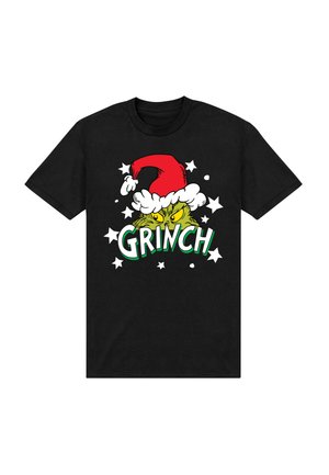 Camiseta negra con un gráfico verde del Grinch que lleva un sombrero de Santa rojo, el texto "GRINCH" y estrellas blancas como acentos de diseño.