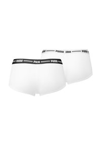 Boxers blancos con una cinturilla negra con el logo de Puma, fabricados en un tejido suave y con un diseño ajustado que presenta un corte sin costuras en las piernas.