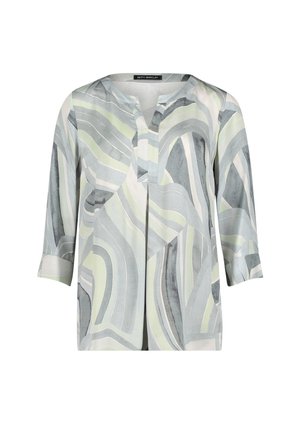 Blouse à manches longues avec des rayures abstraites courbes vert tendre, gris et blanc, et un col en V fendu.