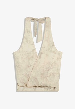 Beige sleeveless wrap crop top with subtle floral pattern and halter neck tie closure.