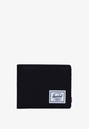 Billetera de tela negra con forma rectangular, que presenta un parche del logo de Herschel en blanco y un acento lateral a rayas en rojo y blanco.