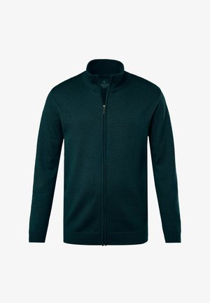 Cárdigan de cremallera en verde oscuro con un cuello alto, textura acanalada, mangas largas y un diseño elegante. Cuenta con un cierre frontal con cremallera.