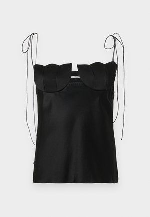 Black sleeveless top with a scalloped neckline, made of smooth fabric. Features adjustable shoulder ties and a simple, fitted design.