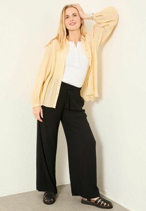 - PALAZZO - Trousers - black