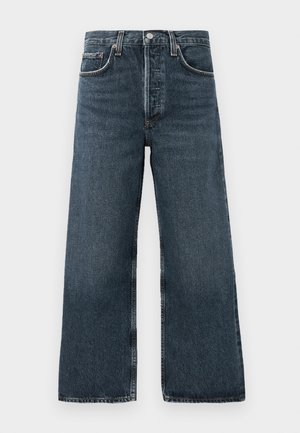 Dark denim wide-leg jeans with a button and zipper closure, featuring five pockets and subtle whiskering on the fabric.