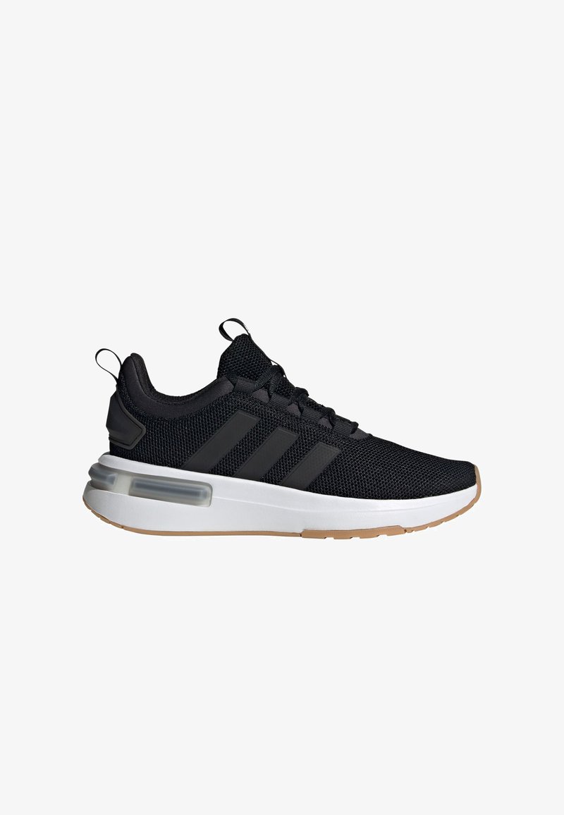 Black athletic shoe with mesh upper, three black stripes, white midsole, and gum rubber outsole. Features pull tab and cushioned heel.