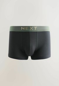 Boxers pour hommes noirs avec une ceinture olive verte portant le mot "NEXT" en lettres beiges, présentés sur un fond clair uni.