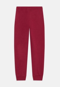 Pantalones de chándal rojos, hechos de una tela suave, con una cintura elástica, puños ajustados y una textura lisa sin ningún patrón ni detalles.
