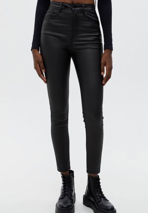 COATED SKINNY TROUSERS - Trousers - mottled black