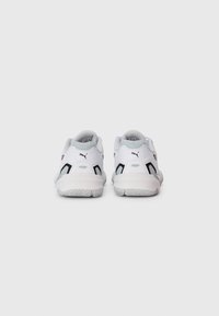 Pair of white and gray Puma sneakers shown from the back on a plain light gray background.