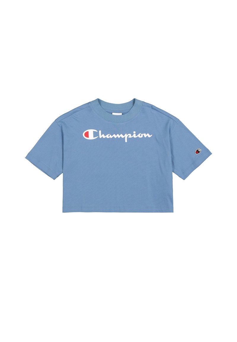Camiseta azul recortada de algodón, con un logotipo blanco de "Champion" en la parte frontal y un pequeño logotipo en la manga izquierda.