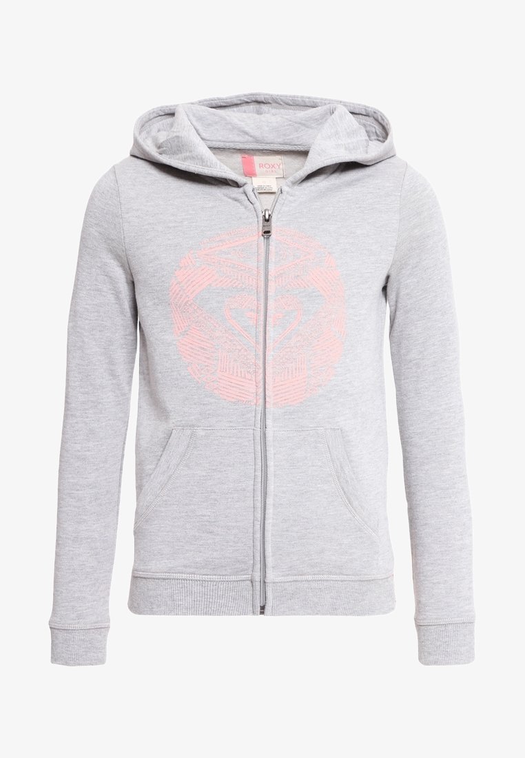 Sweat à capuche gris clair zippé avec poches avant, une capuche, et un discret motif de cœur géométrique rose sur la poitrine.
