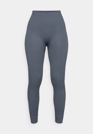 Leggings de cintura alta em tecido canelado cinza escuro. Apresenta um design ajustado e punhos de tornozelo afunilados para uma silhueta elegante.