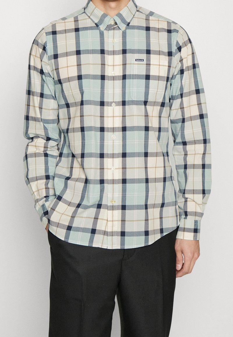 Langarm geruit shirt met een mix van lichtblauw, beige en marineblauwe vierkanten. Gemaakt van zachte stof met een knoopsluiting en een borstzakje.