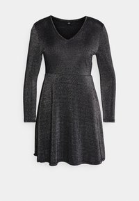 Robe noire à manches longues avec un décolleté en V, fabriquée en tissu scintillant. Silhouette évasée avec un léger éclat et un ourlet fluide.