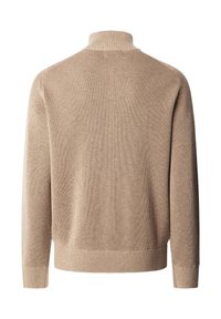 Beige geribbelde trui met een hoge kraag, voorzien van lange mouwen en een aansluitende zoom. Gemaakt van zachte stof met een gestructureerde afwerking.