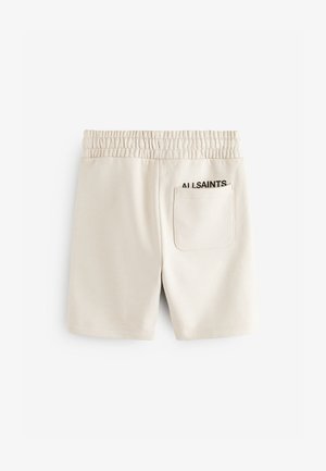 Bēšas šorti no gludas auduma ar elastīgu vidukļa joslu, vienu kabatu aizmugurē un melnā krāsā izdrukātu "ALLSAINTS" logotipu.