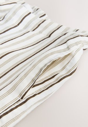 Tissu blanc avec des rayures verticales fines et épaisses marron, avec une ceinture élastique froncée et une poche dans la couture latérale.