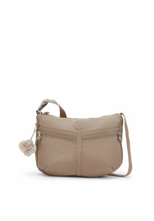 Beige crossbodytas met twee voorvakken met rits, verstelbare schouderriem en een kleine pluchen aap sleutelhanger bevestigd aan de rits.
