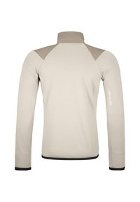 Helle beige Langarmjacke mit erhöhtem Kragen, kontrastierenden grauen Schulterpaneelen, strukturiertem Stoff und schwarzem Besatz an den Bündchen und am Saum.