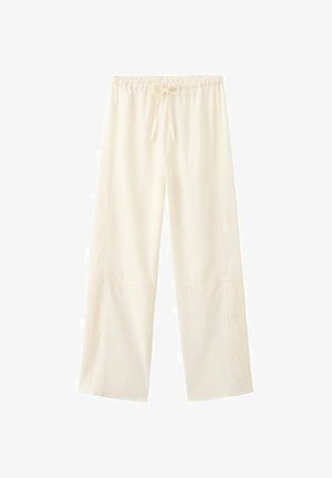 Lichte crèmekleurige wijde broek met een elastische tailleband en trekkoorden. Beschikt over verticale stiksels aan de zijkanten. Zachte stoftextuur.