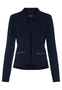 Blazer bleu marine en tissu texturé, avec une coupe ouverte et sans col. Dispose de poches zippées et d'un ourlet légèrement courbé.