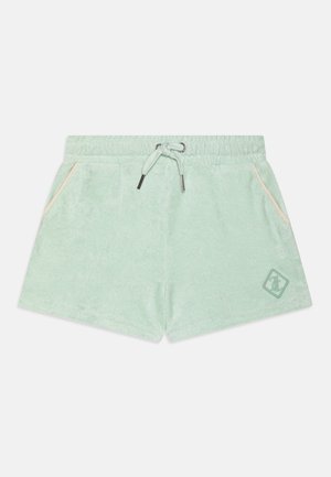 Hellgrüne Frottee-Shorts mit elastischem Bund, Kordelzug, seitlichen Taschen mit Pfirsichbesatz und kleinem Logoaufnäher am linken Bein.