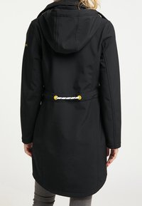 Black, hooded outerwear with a cinched waist, featuring a white rope detail with yellow accents. Constructed from a smooth, flexible fabric.