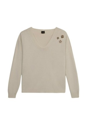 Beige V-halstrui met lange mouwen, geribbelde boorden en zoom. Bevat decoratieve sterren- en bloemenversieringen aan de linkerkant.