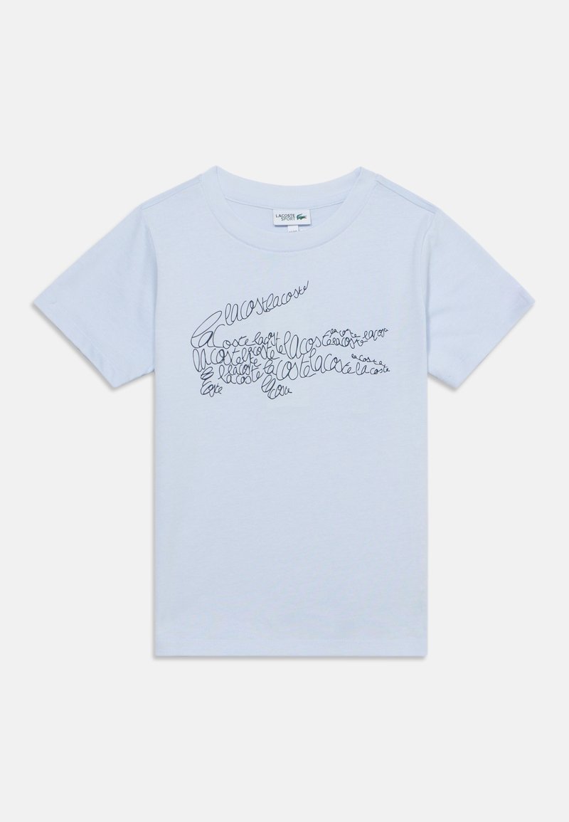 T-shirt bleu clair à manches courtes avec un logo crocodile noir de style manuscrit sur la poitrine et un col rond.