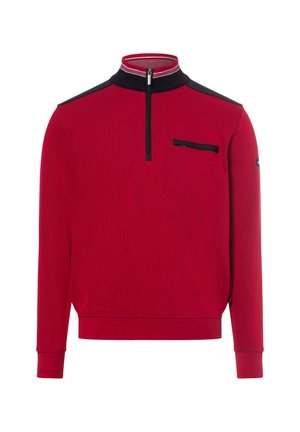 Red pullover with a half zip, black accents on shoulders and collar, textured fabric, and a zippered chest pocket.